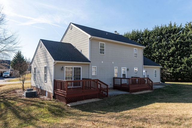 back of house featuring a wooden deck, a yard, and cooling unit