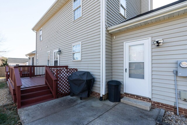 entrance to property with a wooden deck