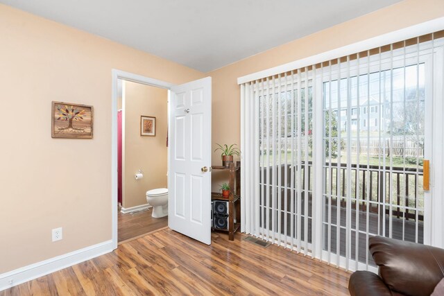 bedroom with hardwood / wood-style flooring