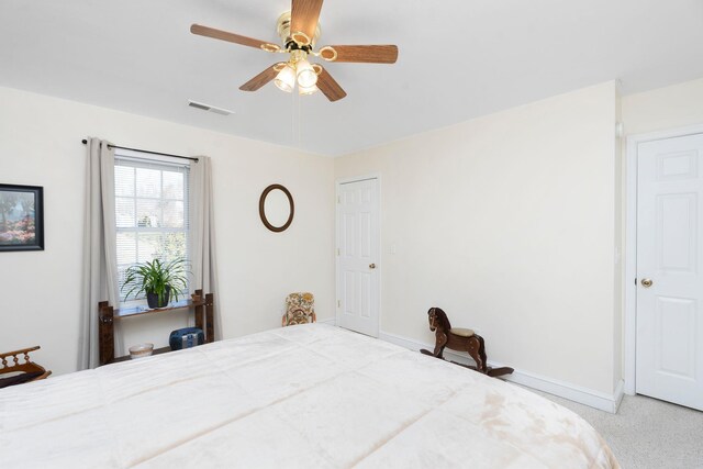 bedroom with light colored carpet and ceiling fan