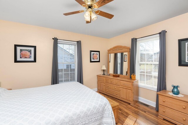 bedroom featuring ceiling fan and light wood-type flooring