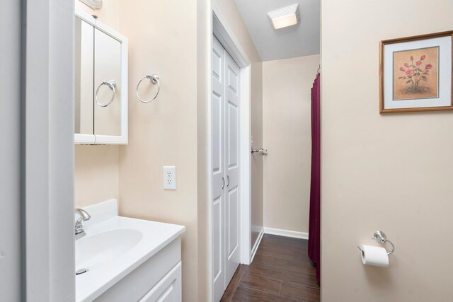 bathroom featuring vanity and hardwood / wood-style flooring