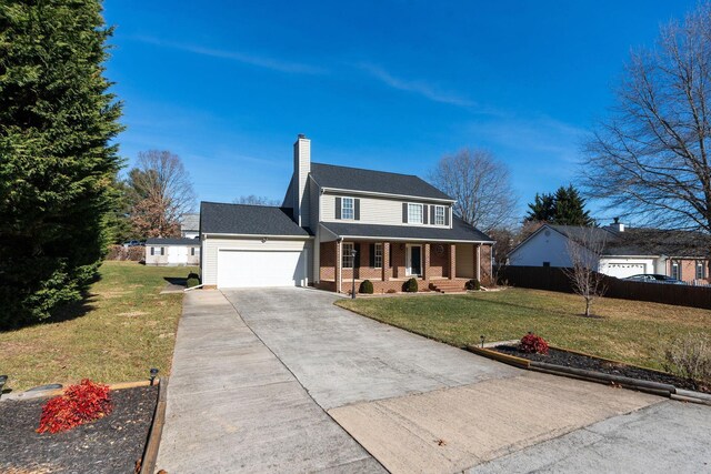 view of front facade with a garage, covered porch, and a front lawn