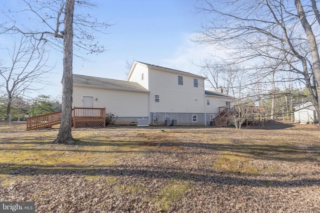 back of property with cooling unit and a deck