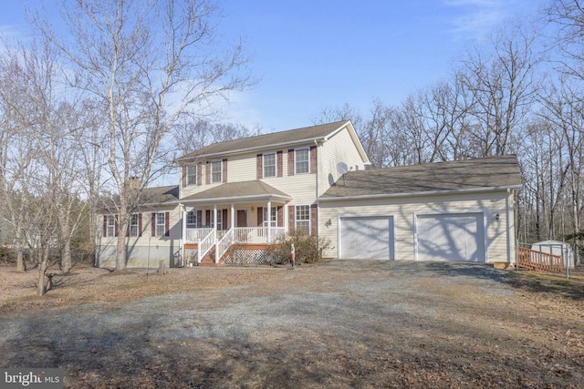 view of front of home with a garage and a porch