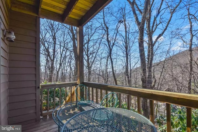 wooden deck with outdoor dining space