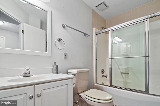 full bathroom with toilet, combined bath / shower with glass door, vanity, and visible vents