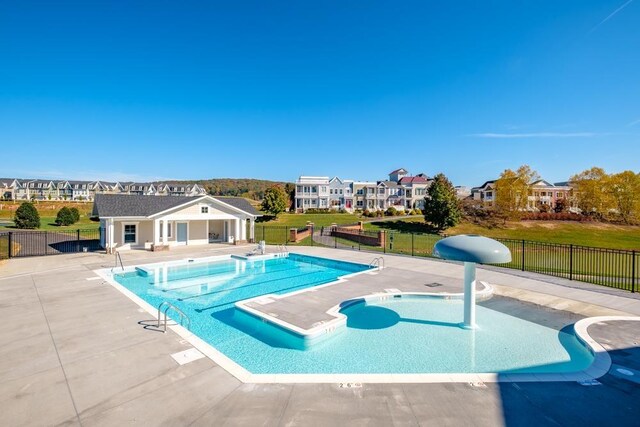 view of swimming pool with a patio