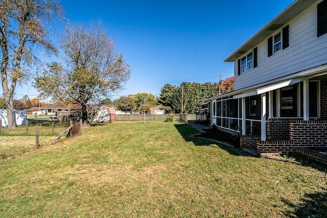 view of yard featuring a sunroom