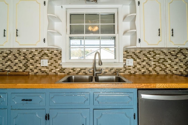 kitchen featuring sink, white cabinets, blue cabinets, decorative backsplash, and stainless steel dishwasher