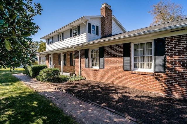 view of front of home with a front lawn and a porch