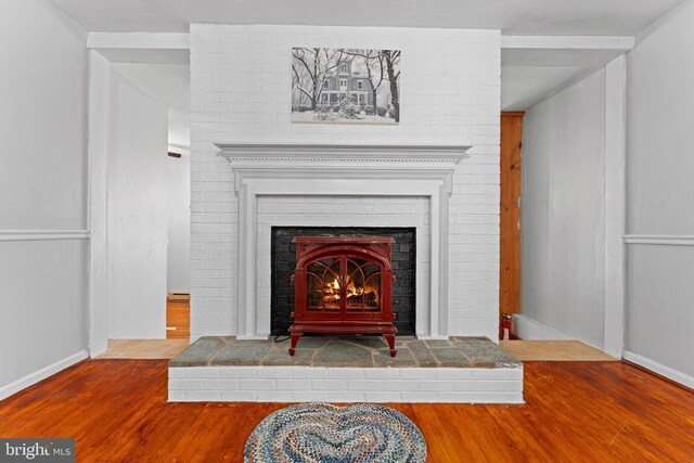 room details featuring hardwood / wood-style flooring and a fireplace