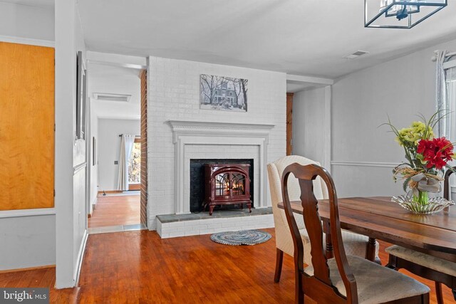 dining space with hardwood / wood-style floors