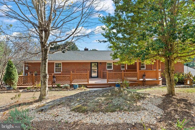 view of front of property with a deck