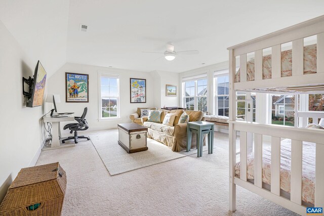 living area featuring a ceiling fan, light carpet, and visible vents