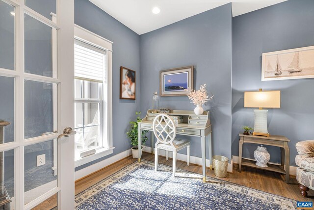 home office with wood finished floors and baseboards