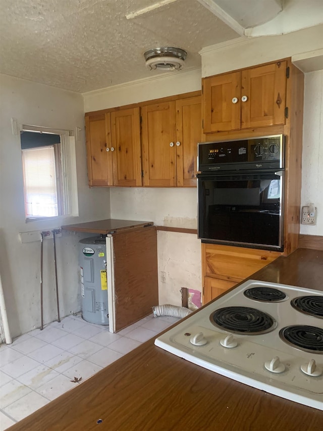 kitchen featuring black oven, stovetop, water heater, a textured ceiling, and light tile patterned flooring