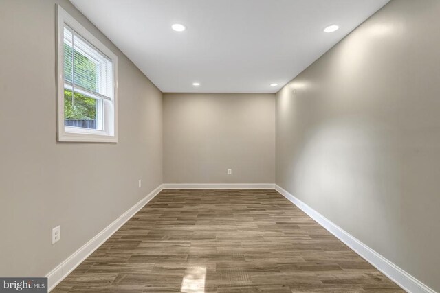 unfurnished room with recessed lighting and wood finished floors