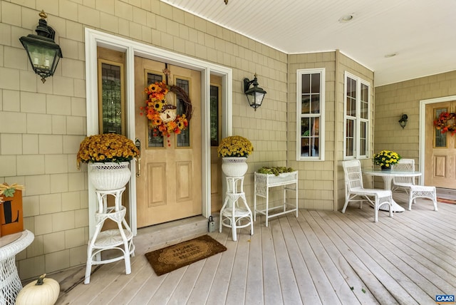 doorway to property featuring a porch