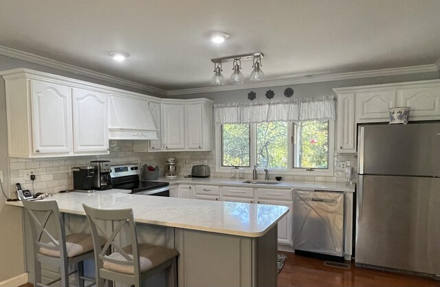 kitchen with white cabinetry, stainless steel appliances, kitchen peninsula, and custom exhaust hood