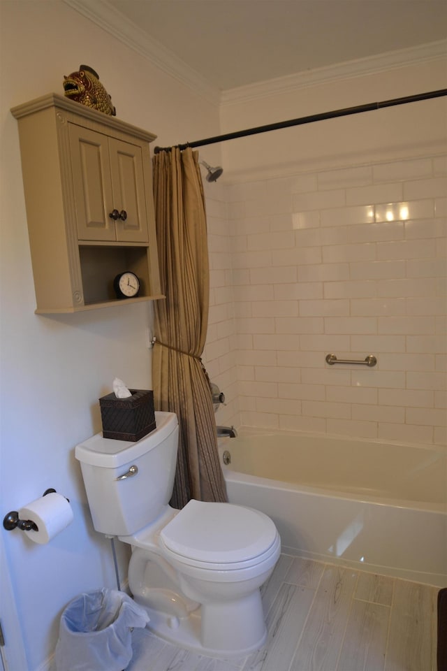 bathroom featuring ornamental molding, toilet, wood-type flooring, and shower / bath combo