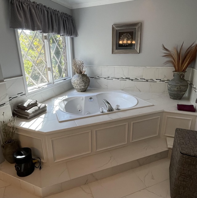 bathroom with a bathing tub and crown molding