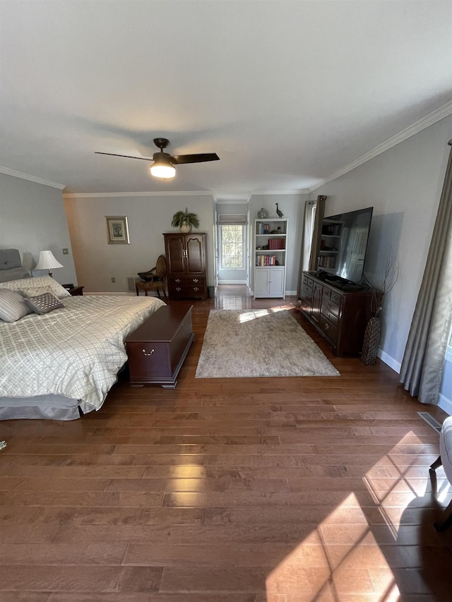 bedroom with wood-type flooring, ornamental molding, and ceiling fan