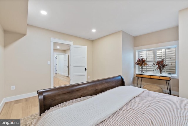 bedroom featuring recessed lighting, baseboards, and wood finished floors