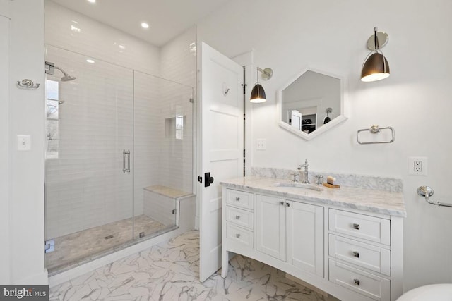 full bathroom with recessed lighting, marble finish floor, a shower stall, and vanity