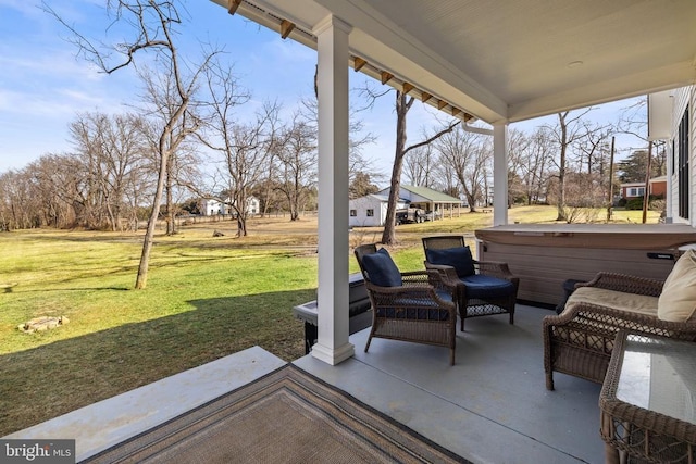 view of patio with a hot tub