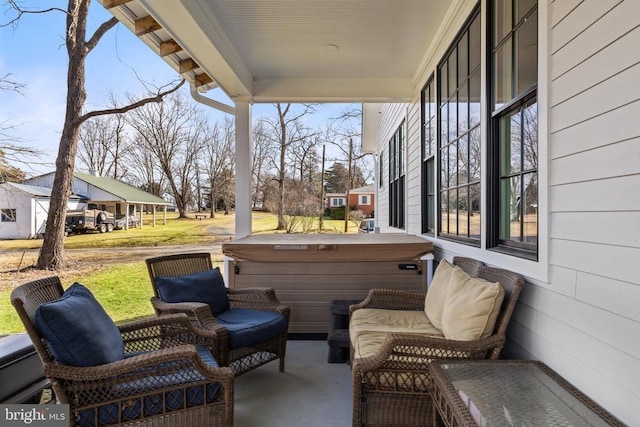 view of patio / terrace featuring a hot tub