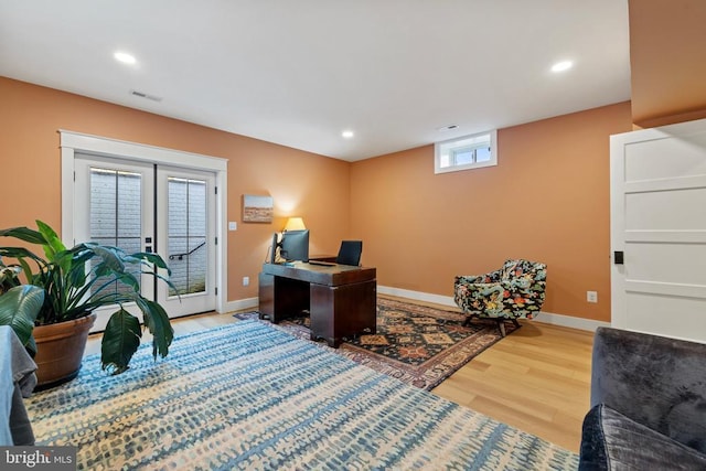 home office with baseboards, visible vents, wood finished floors, and recessed lighting