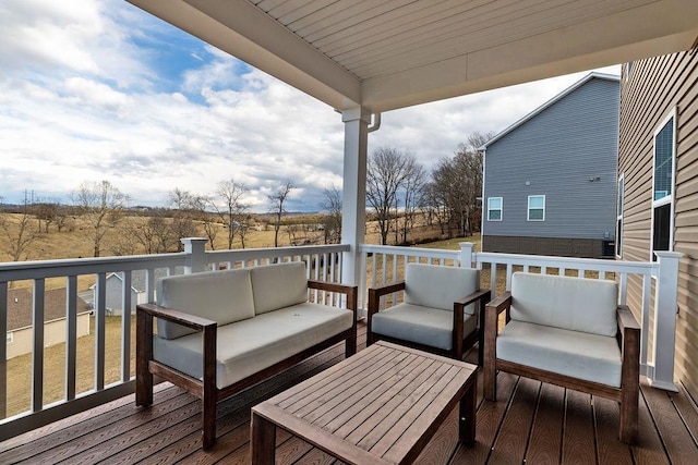 wooden deck with an outdoor hangout area