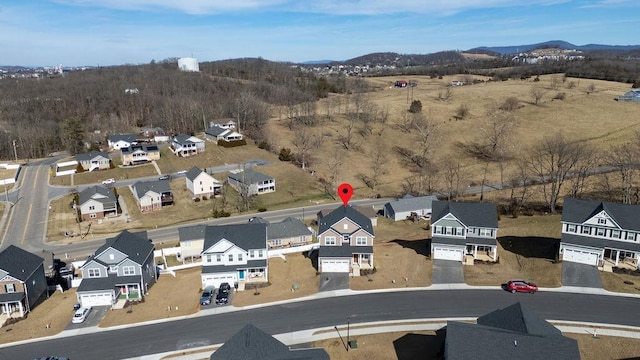 birds eye view of property with a residential view and a mountain view