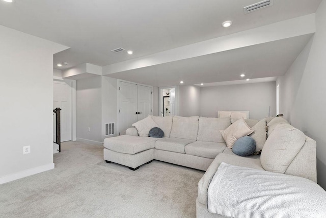 carpeted living room with recessed lighting, visible vents, and baseboards