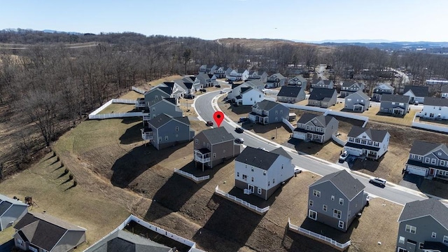 aerial view featuring a residential view and a view of trees