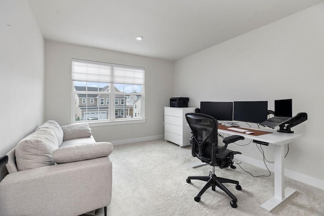 carpeted office space with baseboards