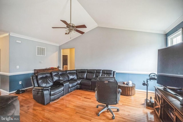 living area with baseboards, visible vents, ornamental molding, wood finished floors, and vaulted ceiling