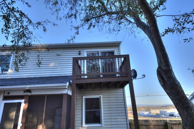 back of house with a balcony