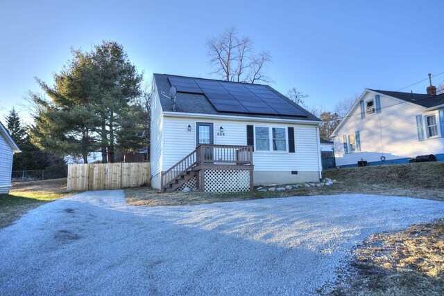 bungalow-style home with solar panels