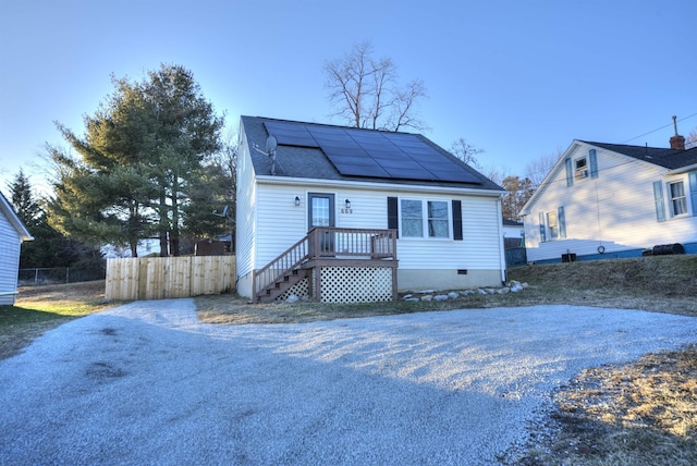 bungalow-style home with solar panels