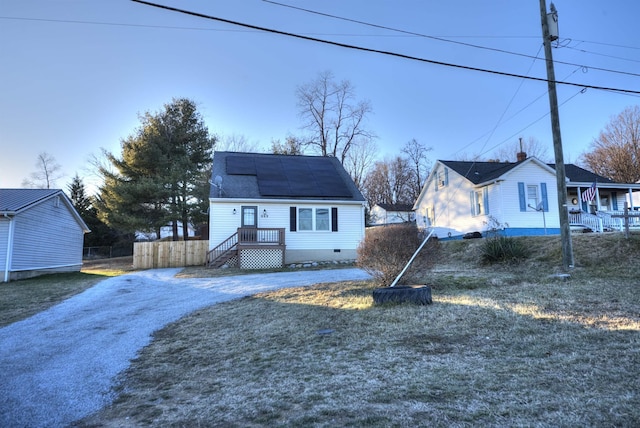 view of front of home featuring solar panels