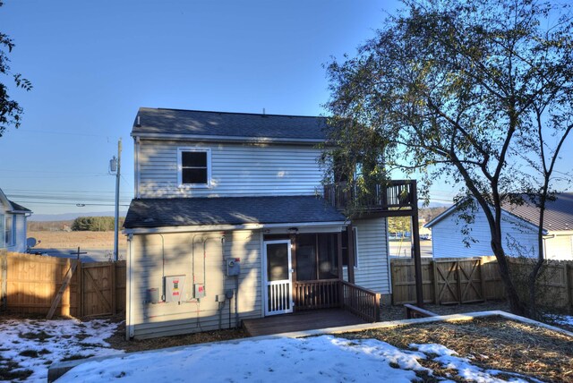 view of front of house featuring a balcony