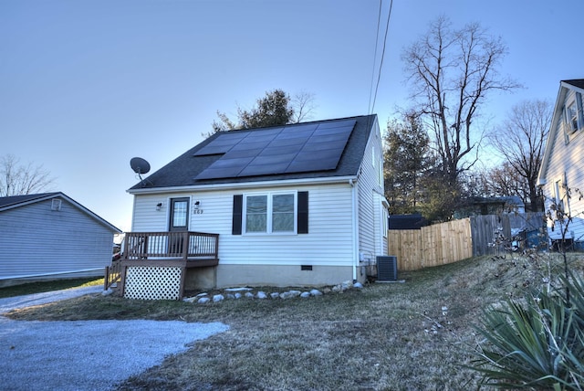 bungalow-style home with solar panels