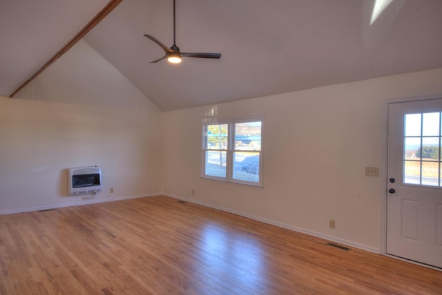 unfurnished living room featuring high vaulted ceiling, heating unit, ceiling fan, and light hardwood / wood-style flooring