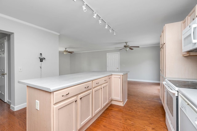 kitchen with crown molding, light hardwood / wood-style flooring, ceiling fan, a kitchen island, and white appliances