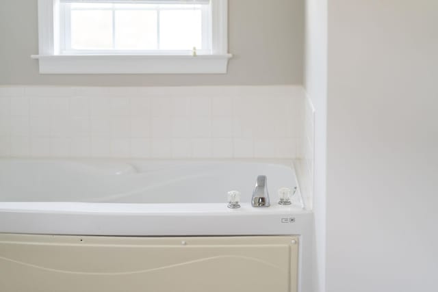 bathroom with a washtub