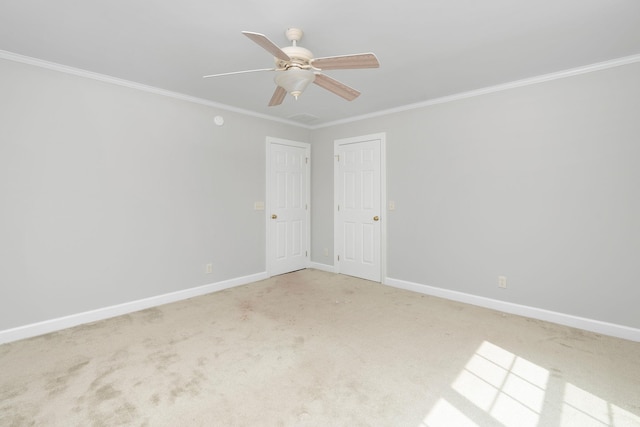 unfurnished room with light carpet, ornamental molding, and ceiling fan