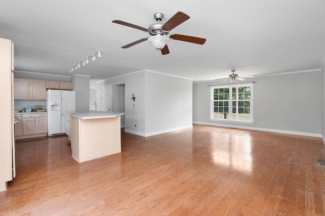 unfurnished living room with rail lighting, ornamental molding, light hardwood / wood-style floors, and ceiling fan