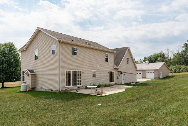 rear view of property with a yard and a patio